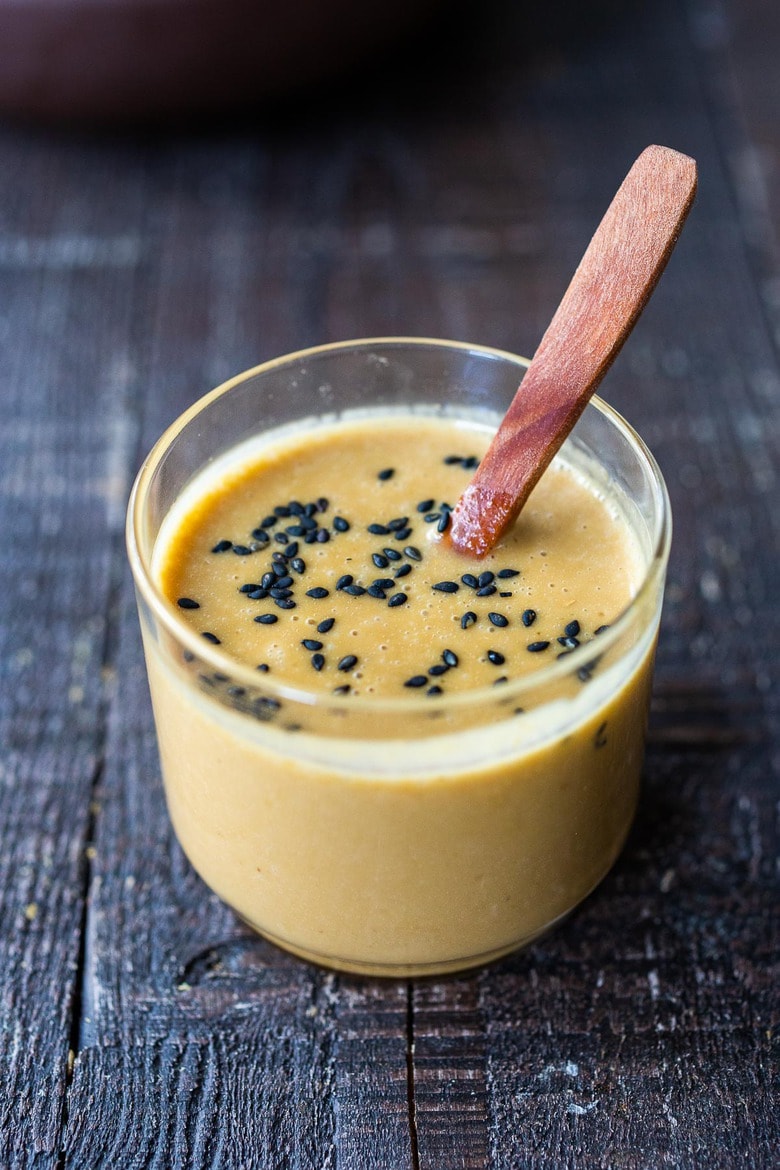 How to make the BEST Miso Dressing. Infused with ginger, sesame oil, this vegan Asian-style dressing is full of flavor. Delicious on grain bowls, grilled or roasted veggies, or tossed with crunchy Asian Slaw!