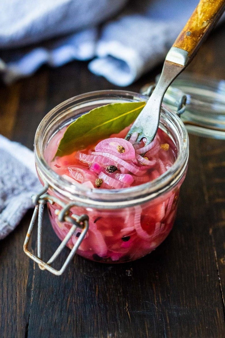 Quick and easy Pickled Shallots require only 10 minutes of hands-on time before going in the fridge to chill.  Use in sandwiches, wraps, salads, to add a bit of zippy brightness. #pickledshallots