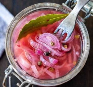Quick and easy Pickled Shallots require only 10 minutes of hands-on time before going in the fridge to chill.  Use in sandwiches, wraps, salads, to add a bit of zippy brightness. #pickledshallots
