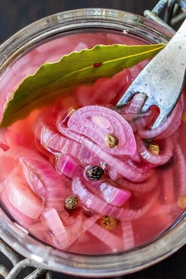 Quick and easy Pickled Shallots require only 10 minutes of hands-on time before going in the fridge to chill.  Use in sandwiches, wraps, salads, to add a bit of zippy brightness. #pickledshallots