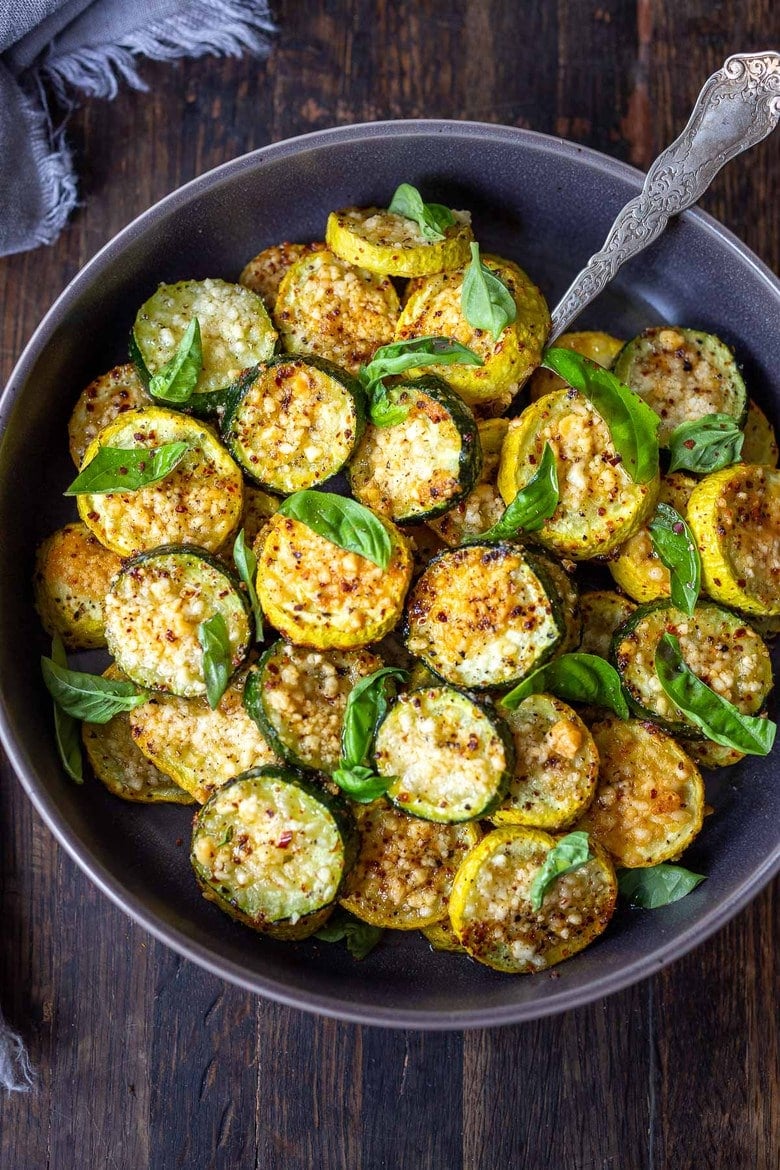 20 BEST Zucchini Recipes | Crispy Baked Zucchini with Pecorino and Basil- a crispy flavorful zucchini side dish that is simply irresistible and pairs well with many things!