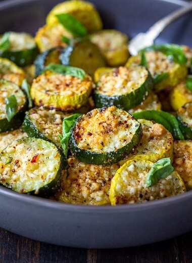 Baked Zucchini with Pecorino and Basil- a crispy flavorful zucchini side dish that is simply irresistible and pairs well with many things!