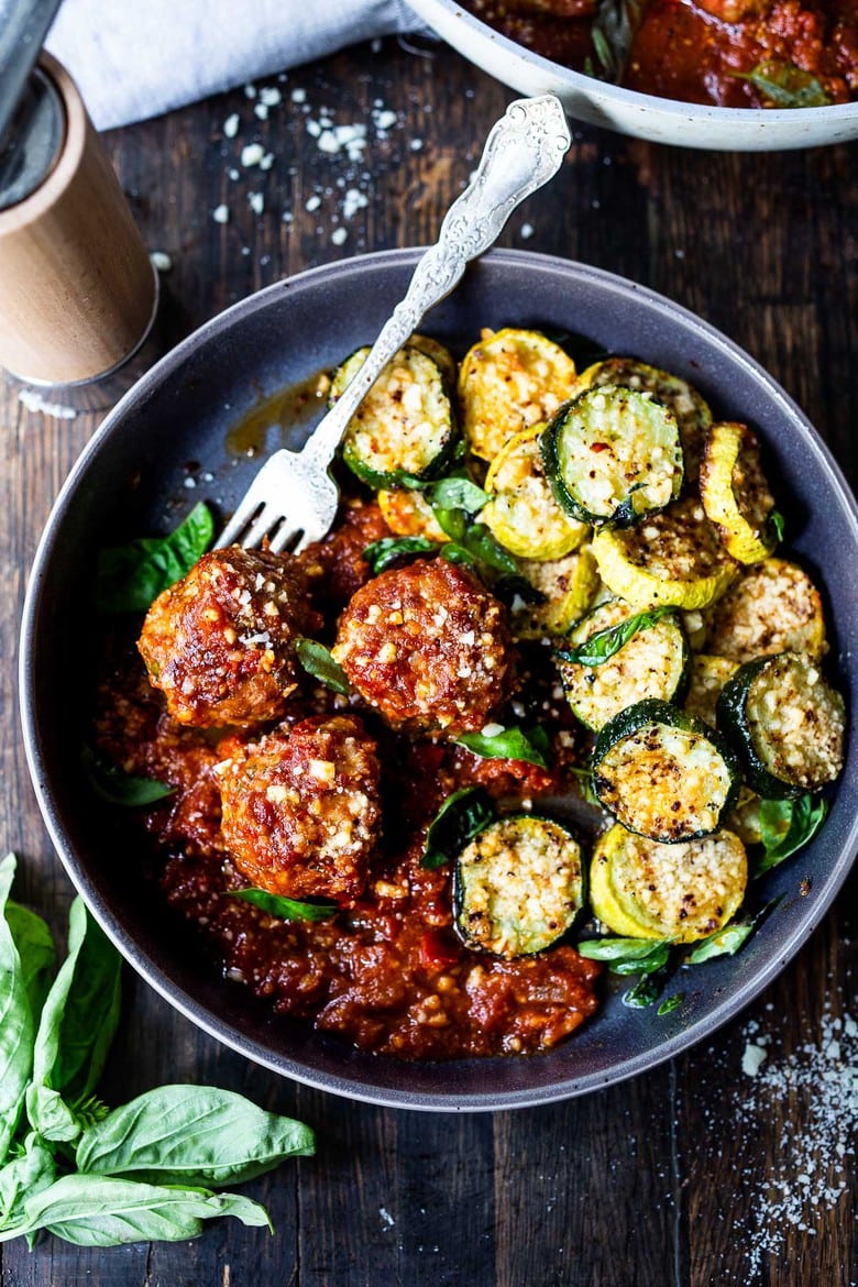 Baked Zucchini with Pecorino and Basil- a crispy flavorful zucchini side dish that is simply irresistible and pairs well with many things!
