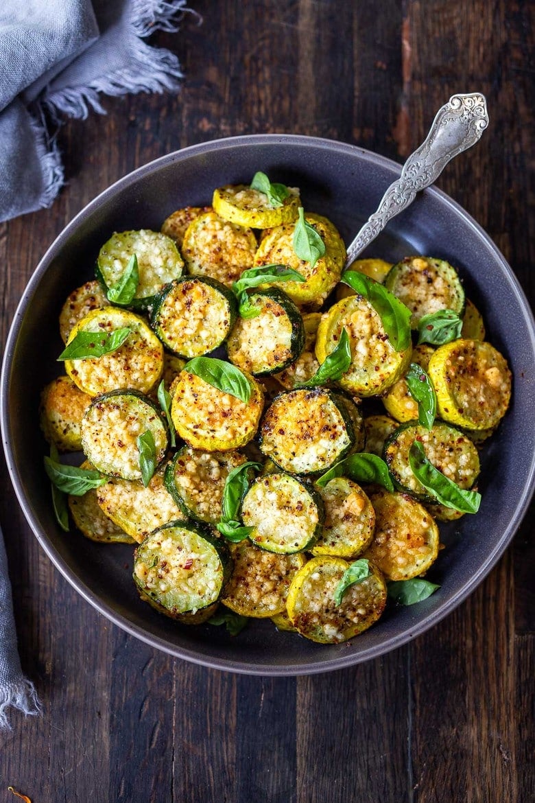 Baked Zucchini with Pecorino and Basil- a crispy flavorful zucchini side dish that is simply irresistible and pairs well with many things!