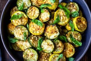 Baked Zucchini with Pecorino and Basil- a crispy flavorful zucchini side dish that is simply irresistible and pairs well with many things!