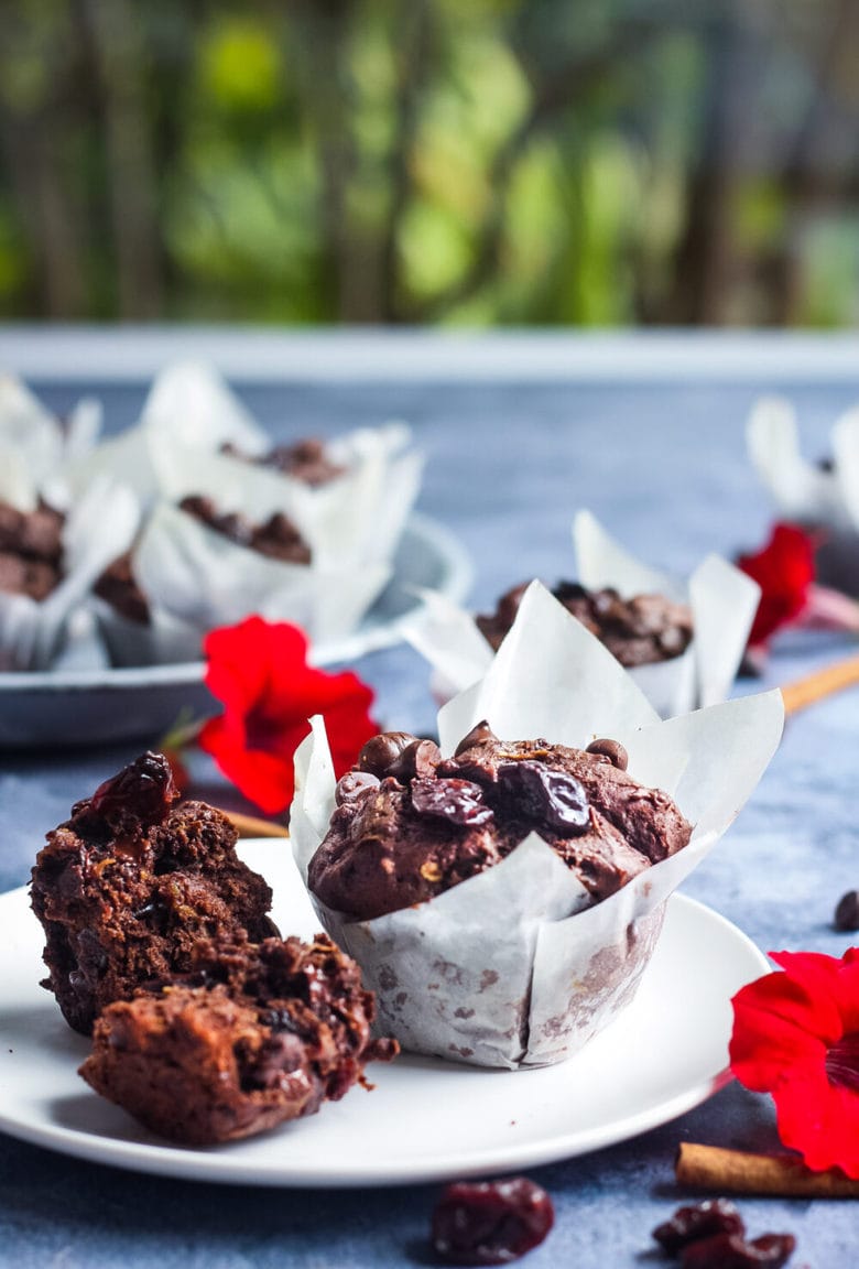 Double Chocolate Zucchini Muffins with Dried Cherries have a hint of spice and are richly satisfying -a delicious treat with a bit of healthy tucked inside!