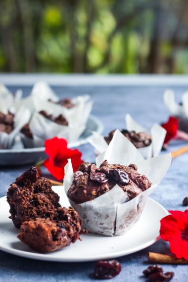 Double Chocolate Zucchini Muffins with Dried Cherries have a hint of spice and are richly satisfying -a delicious treat with a bit of healthy tucked inside!