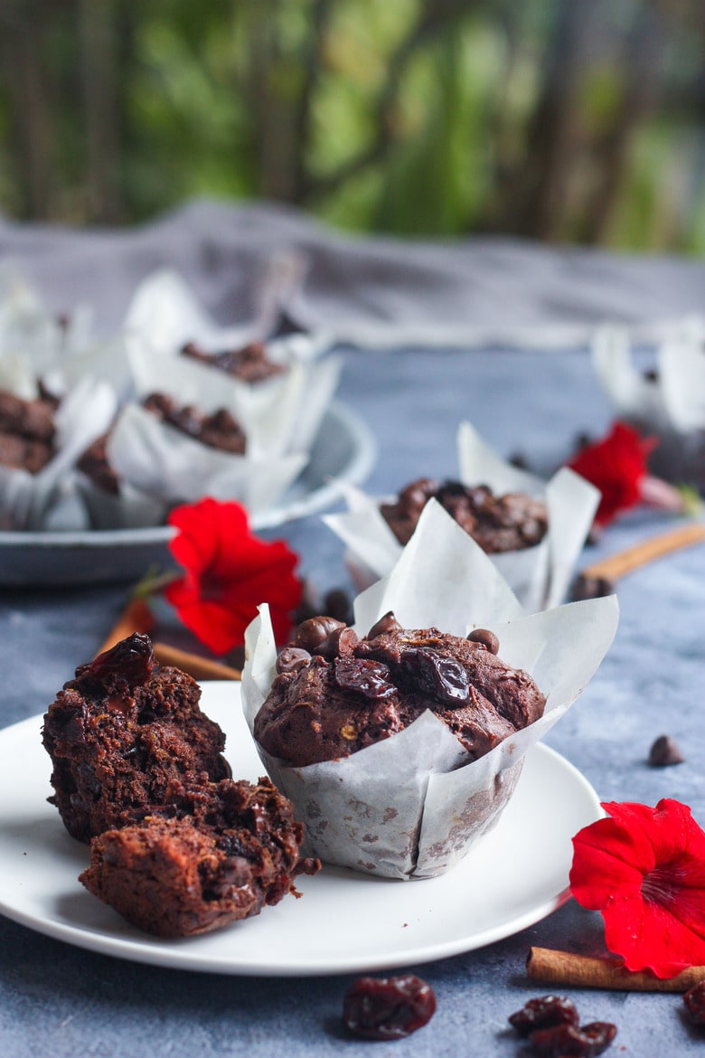 Double Chocolate Zucchini Muffins with Dried Cherries have a hint of spice and are richly satisfying -a delicious treat with a bit of healthy tucked inside!