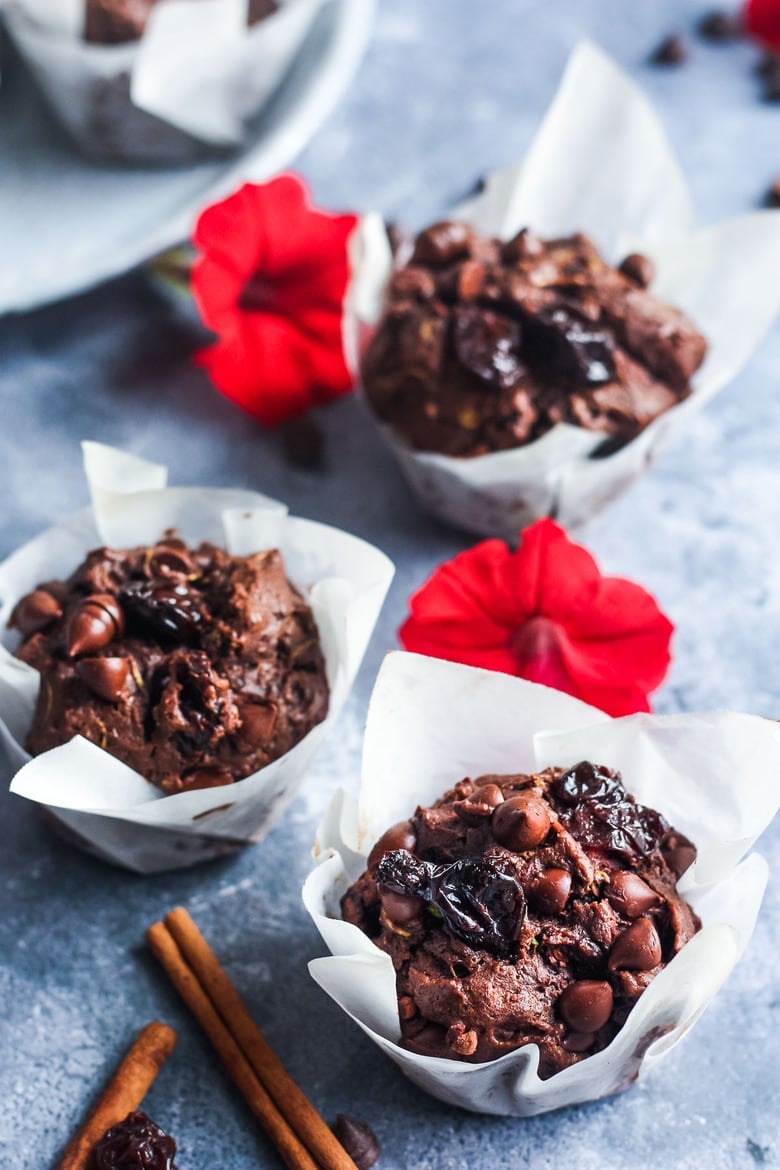 Double Chocolate Zucchini Muffins with Dried Cherries have a hint of spice and are richly satisfying -a delicious treat with a bit of healthy tucked inside!
