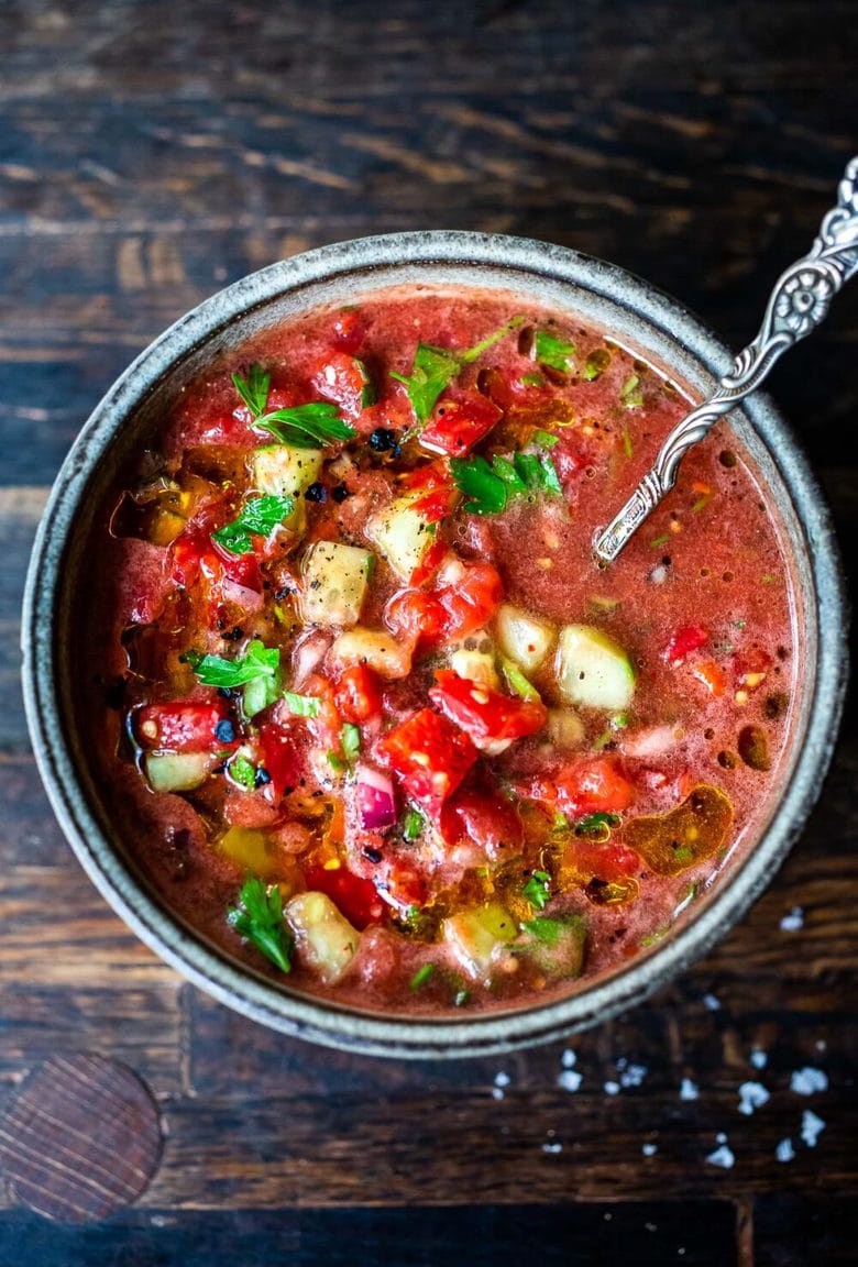 A quick and easy recipe for Gazpacho, a chilled, no-cook, Spanish soup highlighting ripe and juicy summer tomatoes. Vegan and gluten-free with several variations!  #gazpacho #coldsoup #vegansoup