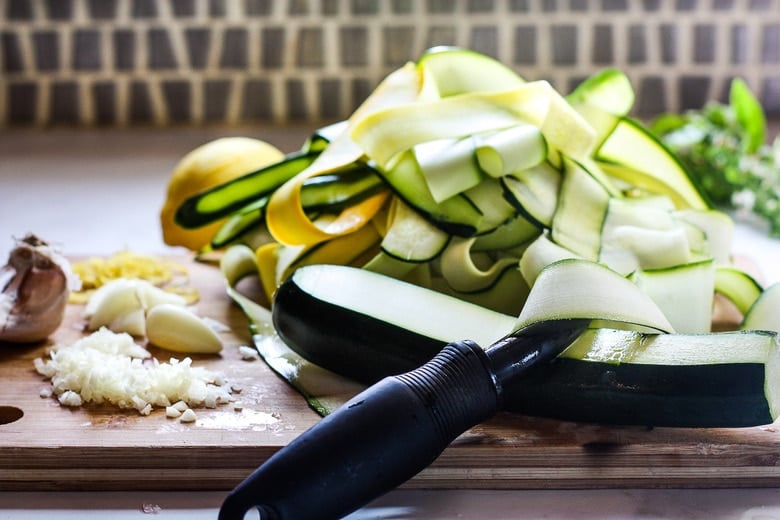 chopped garlic, making zucchini ribbons using a vegetable peeler
