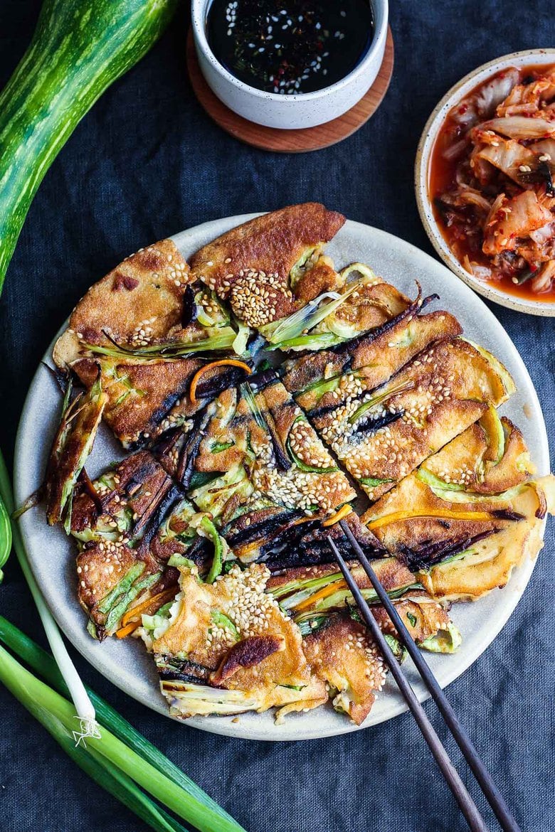 20 BEST Zucchini Recipes | These Korean-inspired Zucchini Scallion Pancakes are a simple tasty treat!  No-fuss preparation and ready to serve in minutes.  Packed with zucchini and scallions, held together with rice flour and eggs, heavy on the veggies.  Seasoned with gochujang pepper chili paste and a touch of rice wine, they are filled with savory flavor.