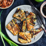 These Korean-inspired Zucchini Scallion Pancakes are a simple tasty treat! No-fuss preparation and ready to serve in minutes. Packed with zucchini and scallions, held together with rice flour and eggs, heavy on the veggies. Seasoned with gochujang pepper chili paste and a touch of rice wine, they are filled with savory flavor.