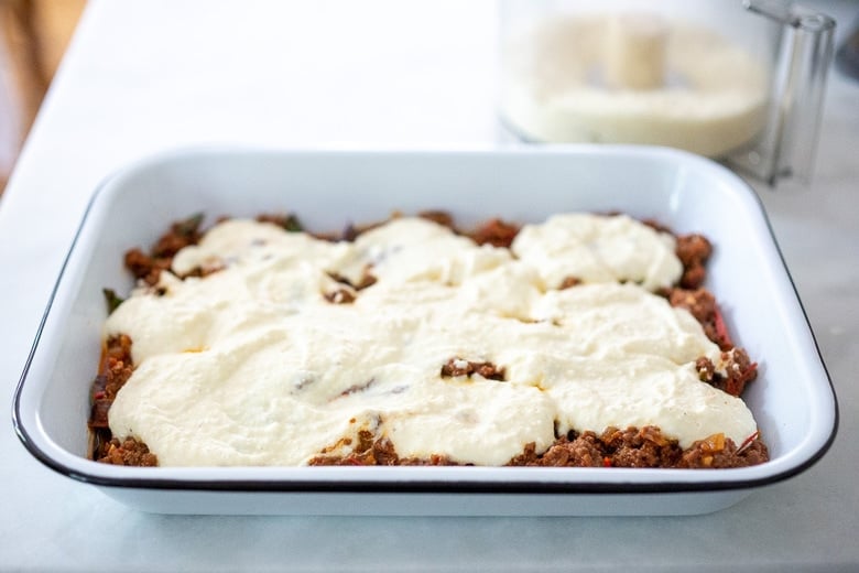 Ricotta mixture over the meat sauce. 