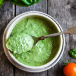 Creamy Pesto Dressing is a rich and vibrant compliment to so many dishes. Simple to make with just 5 ingredients. Perfect for pasta salads, sandwiches and dip. Vegan adaptable.