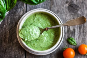 Creamy Pesto Dressing is a rich and vibrant compliment to so many dishes.  Simple to make with just 5 ingredients.  Perfect for pasta salads, sandwiches and dip.  Vegan adaptable.