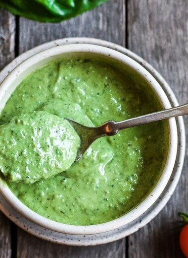 Creamy Pesto Dressing is a rich and vibrant compliment to so many dishes.  Simple to make with just 5 ingredients.  Perfect for pasta salads, sandwiches and dip.  Vegan adaptable.