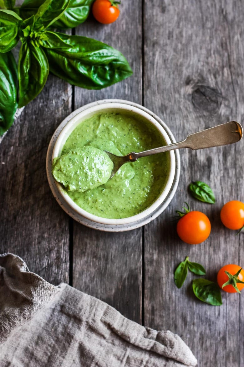 Creamy Pesto Dressing is a rich and vibrant compliment to so many dishes.  Simple to make with just 5 ingredients.  Perfect for pasta salads, sandwiches and dip.  Vegan adaptable.