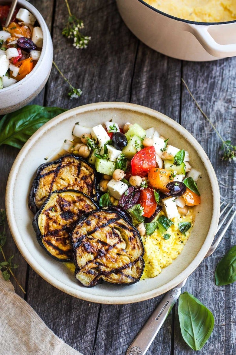 Perfectly tender smoky Grilled Eggplant with fresh Greek relish and creamy polenta.  An easy and healthy meatless dinner.  Vegan adaptable and gluten-free.