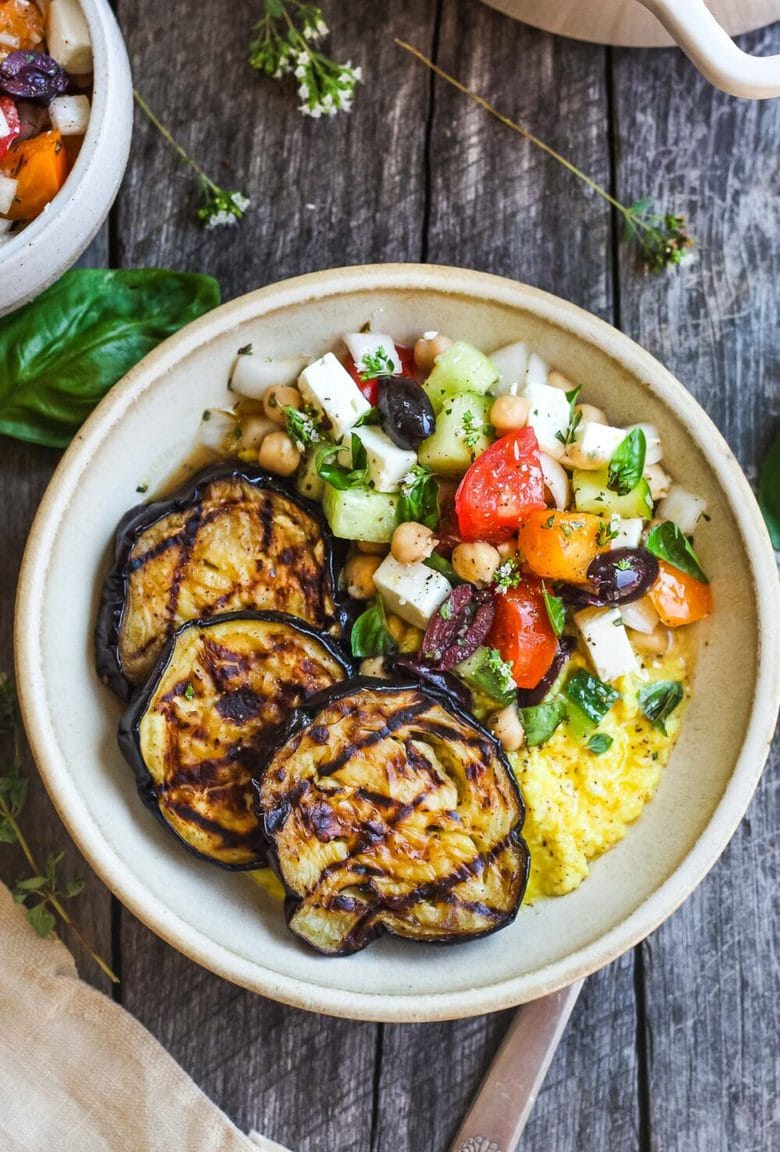 Perfectly tender smoky Grilled Eggplant with fresh Greek relish and creamy polenta.  An easy and healthy meatless dinner.  Vegan adaptable and gluten-free.