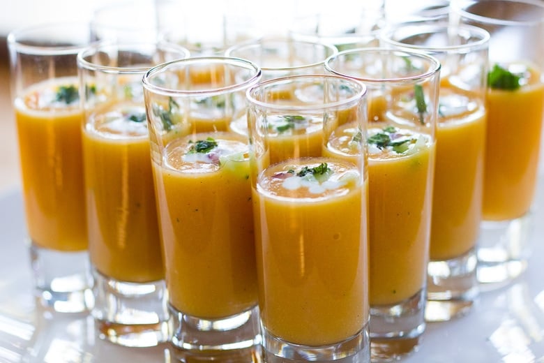 Pureed gazpacho in a shot glass.