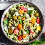 Pesto Pasta Salad w/ cherry tomatoes, baby mozzarella, olives & fresh basil tossed in a Creamy Pesto Dressing. Vegan, gluten-free adaptable.