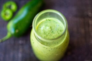 Avocado Dressing with cilantro, lime, and jalapeno- creamy and vegan, a delicious addition to salads, bowls, tacos, enchiladas, and burritos that can be made in 5 minutes.