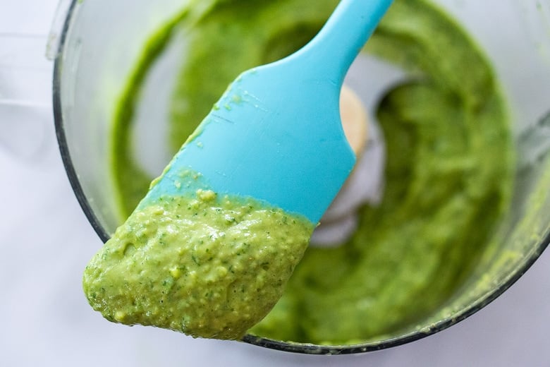 Blended avocado sauce on the tip of a spatula. 