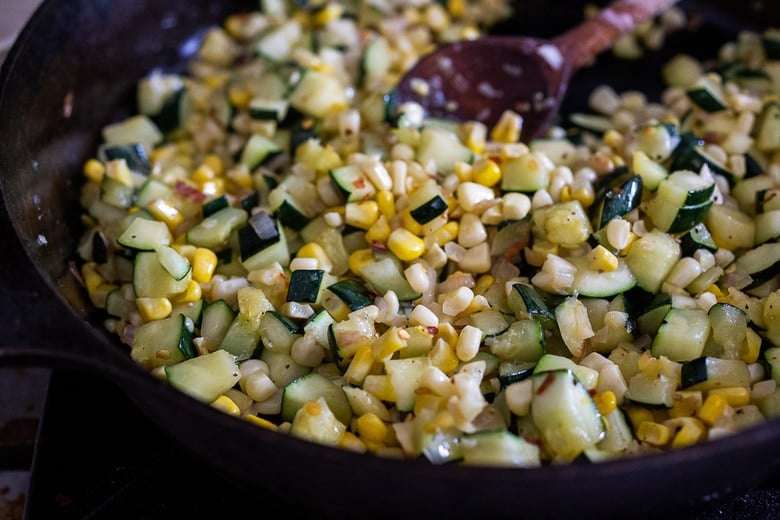 Adding the corn to the skillet