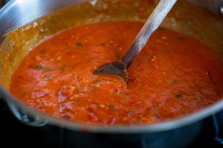 Marinara sauce in a pan simmering.