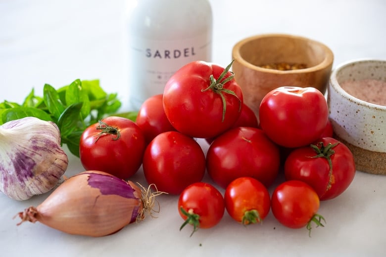 Ingredients in marinara sauce- tomatoes, garlic, onions or shallots, olive oil, oregano and fresh basil