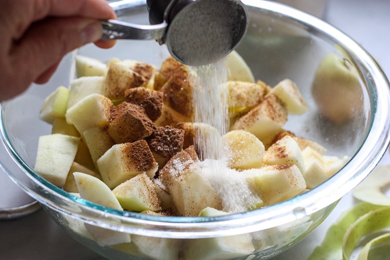 mixing apples with spices and sugar