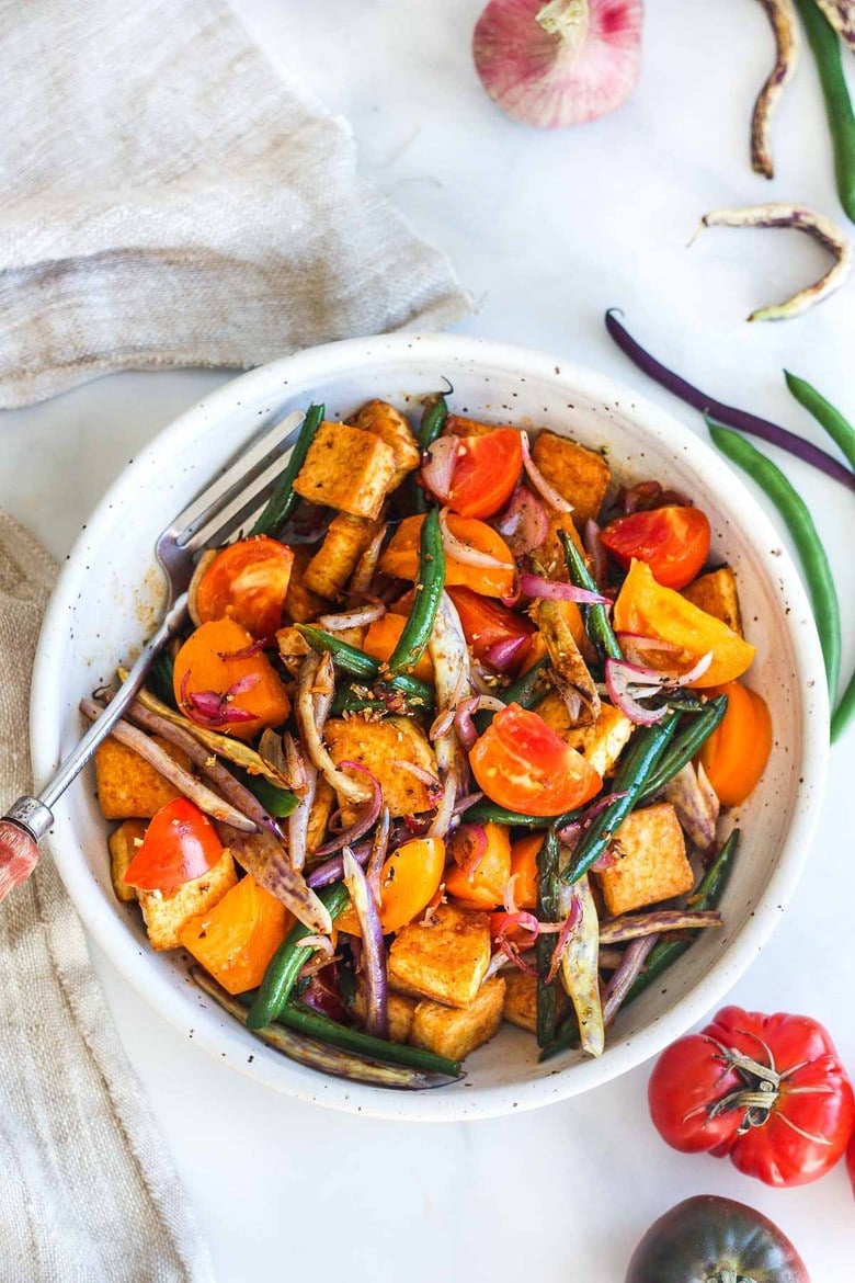 Thai Green Bean and Tofu Stir Fry is full of crunch and flavor.   Spiced up with red curry paste, shallots, ginger and lemongrass for a quick and savory 30 minute meal.   Vegan and GF.