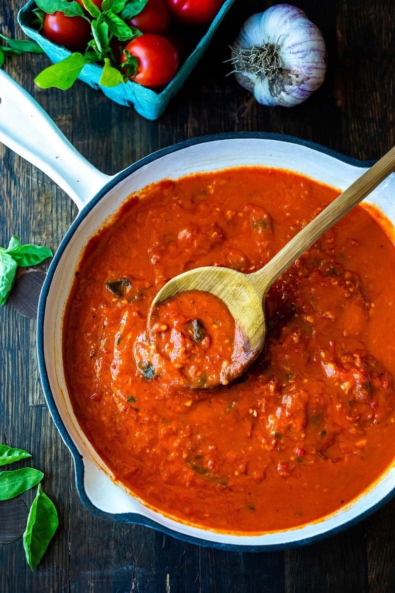 A fast and easy recipe for Marinara Sauce using fresh or canned tomatoes, with garlic, onions and oregano and basil cooked on the stovetop in under 30 minutes. Use this classic Marinara Sauce on pasta, pizza or meatballs. 