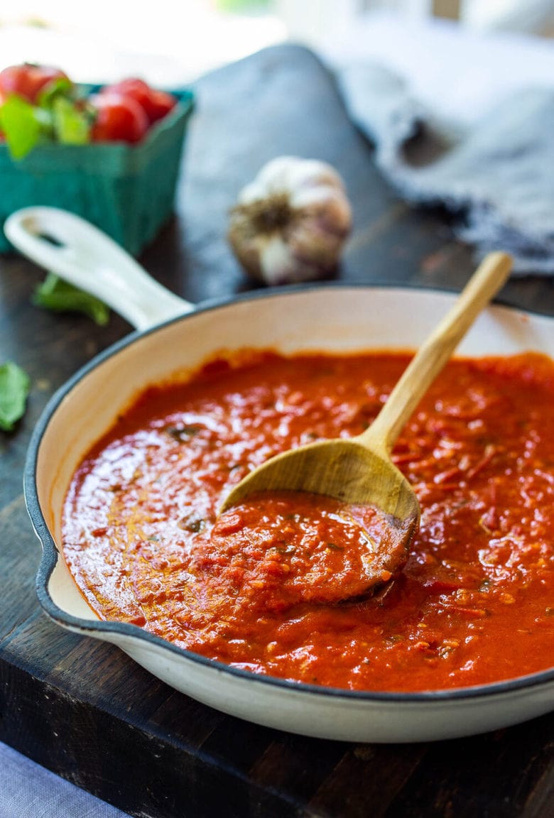 A fast and easy recipe for Marinara Sauce using fresh or canned tomatoes, with garlic, onions and oregano and basil cooked on the stovetop in under 30 minutes. Use this classic Marinara Sauce on pasta, pizza or meatballs.