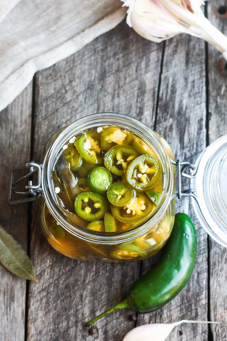 How to make easy homemade Pickled Jalapeños -a deliciously tangy, sweet and spicy accent to tacos, burgers, soups, burritos, and more! 