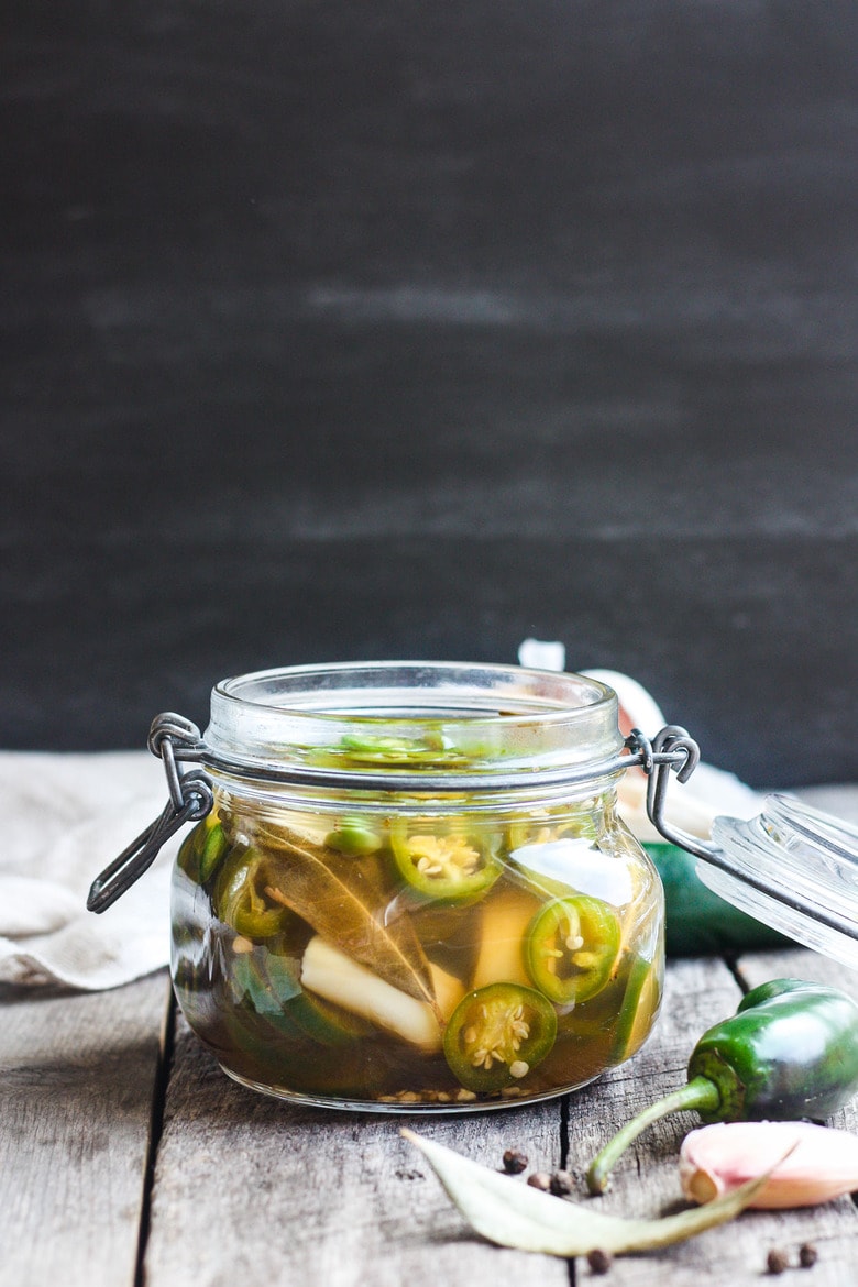 How to make easy homemade Pickled Jalapeños -a deliciously tangy, sweet and spicy accent to tacos, burgers, soups, burritos, and more! 