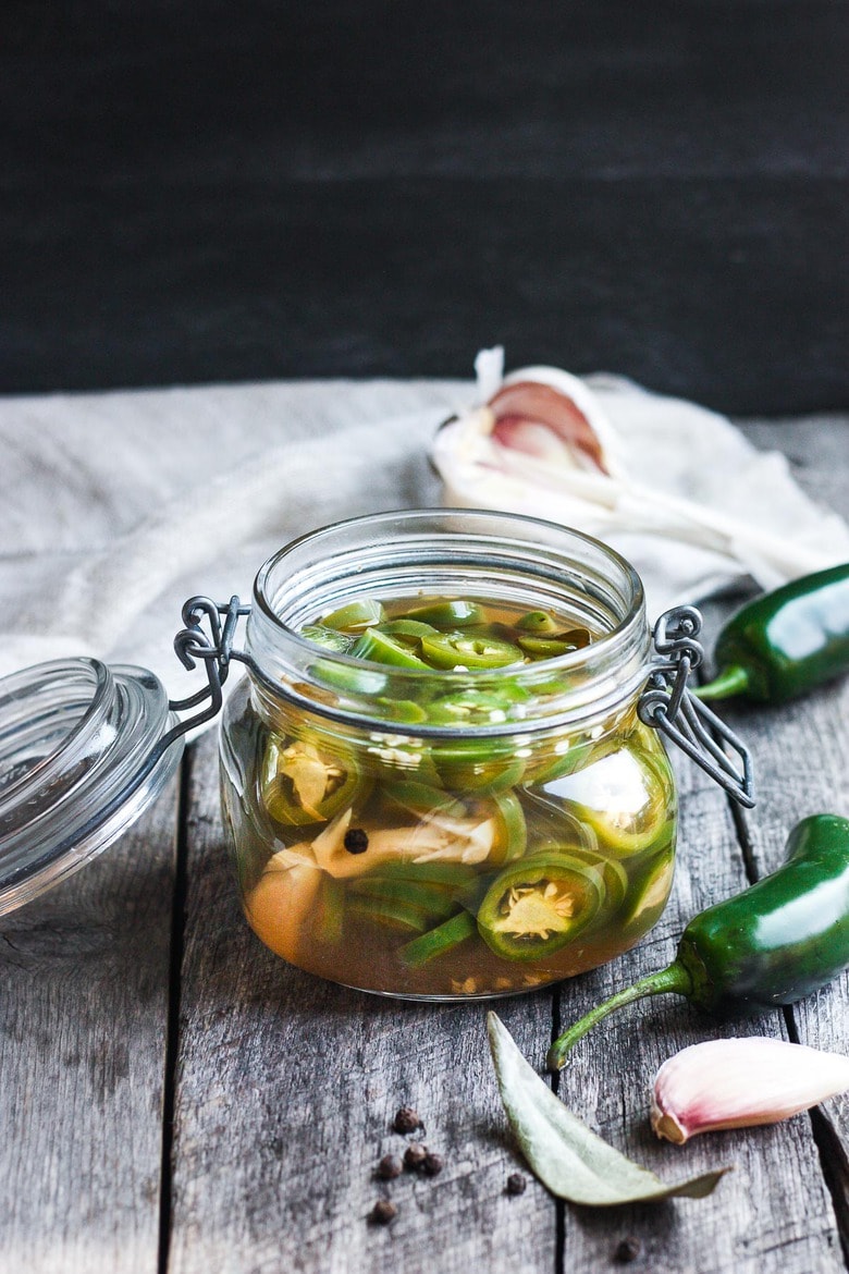 How to make homemade Pickled Jalapeños -a deliciously tangy, sweet and spicy accent to tacos, burgers, soups, burritos, and more! 