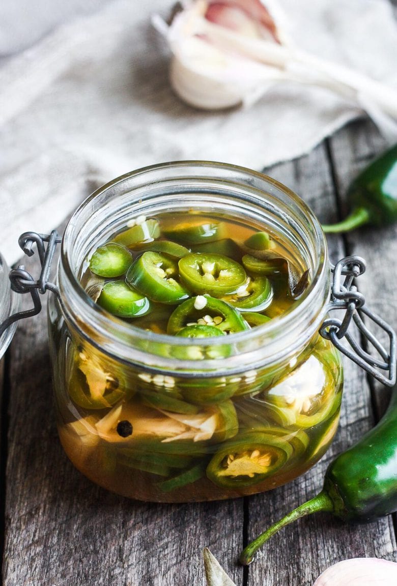 How to make easy homemade Pickled Jalapeños -a deliciously tangy, sweet and spicy accent to tacos, burgers, soups, burritos, and more!
