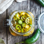 How to make easy homemade Pickled Jalapeños -a deliciously tangy, sweet and spicy accent to tacos, burgers, soups, burritos, and more!