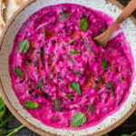 Vibrant Beet Tzatziki made with grated beets, cucumber, Greek yogurt and fresh herbs- a festive appetizer or complementary side dish to Mediterranean-inspired meals. Vegan-adaptable!