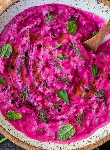 Vibrant Beet Tzatziki made with grated beets, cucumber, Greek yogurt and fresh herbs- a festive appetizer or complementary side dish to Mediterranean-inspired meals.  Vegan-adaptable!