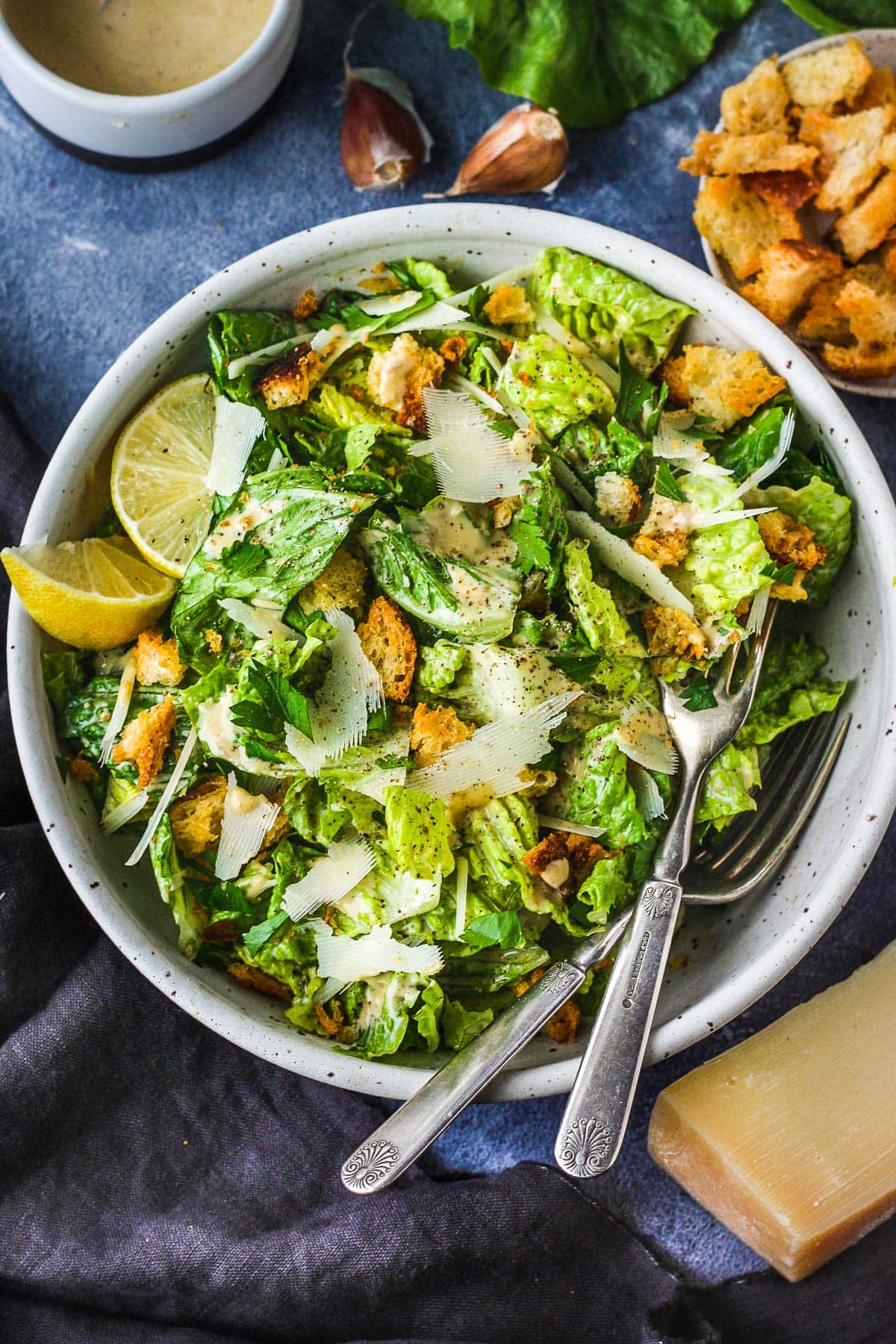 How to make a Classic Caesar Salad from scratch with a rich and tangy homemade Caesar dressing, parmesan cheese and hand-torn croutons.