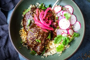 A flavorful recipe for Chicken Mole Negro is made with Black Mole Sauce- smoky, spicy and nutty with dried chilies, and a hint of chocolate. A flavorful Oaxacan-inspired meal.