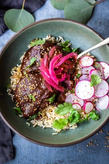 A flavorful recipe for Chicken Mole Negro is made with Black Mole Sauce- smoky, spicy and nutty with dried chilies, and a hint of chocolate. A flavorful Oaxacan-inspired meal. #mole #molenegro