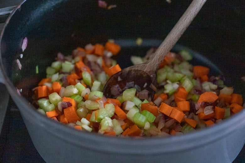 adding carrots, celery and garlic 