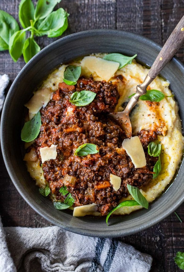30 comfort food Recipes for fall! Rich and robust, this plant-based Lentil Bolognese is hearty, "meaty" and full of depth of flavor. Toss it with your favorite pasta, or spoon it over creamy polenta- either way, this simple nourishing vegan meal is one the whole family will enjoy. #lentilbolognese