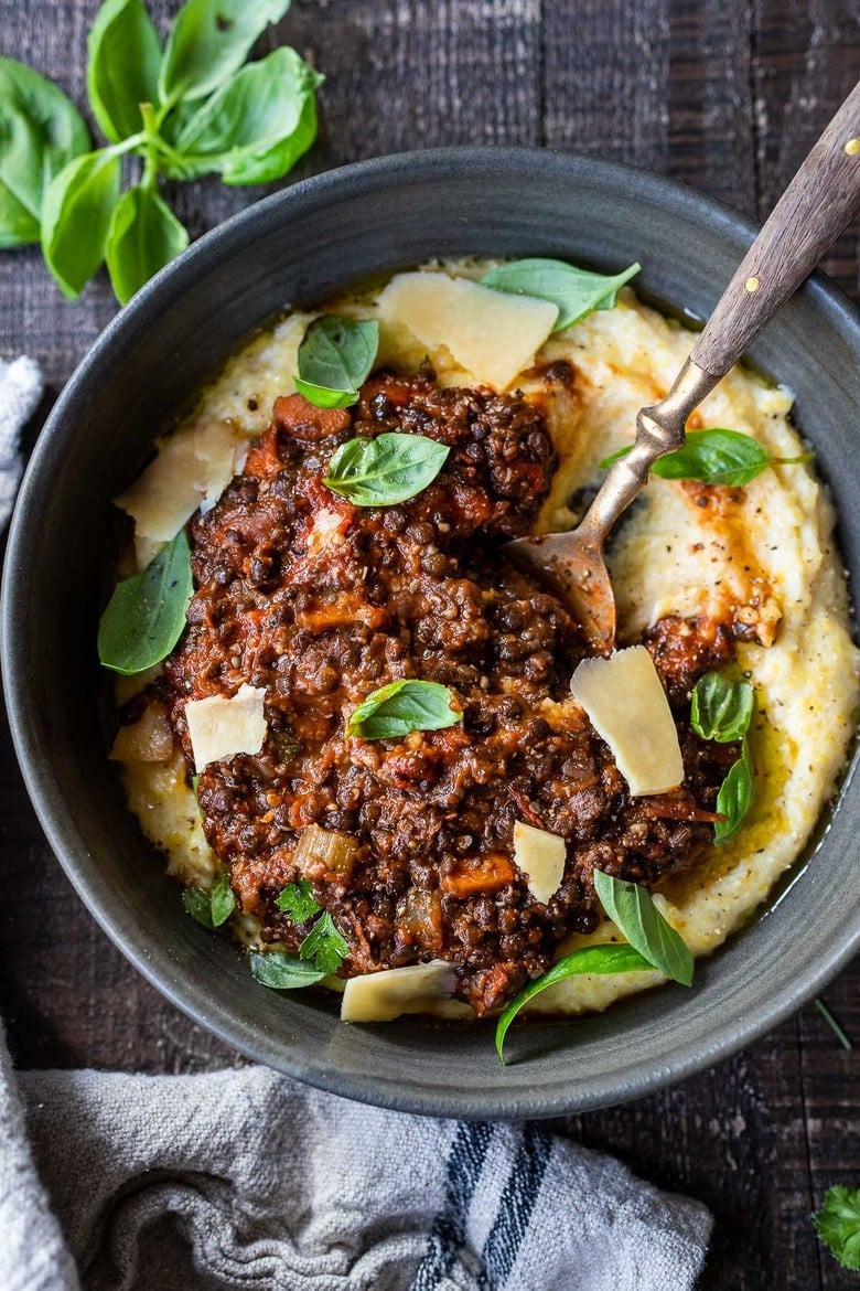 Rich and robust, this plant-based Lentil Bolognese is hearty, "meaty" and full of depth of flavor. Toss it with your favorite pasta, or spoon it over creamy polenta- either way, this simple nourishing vegan meal is one the whole family will enjoy. #lentilbolognese