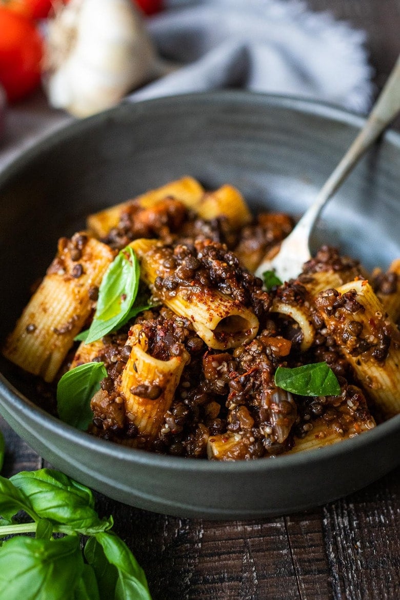 Rich and robust, this plant-based Lentil Bolognese is hearty, "meaty" and full of depth of flavor. Toss it with your favorite pasta, or spoon it over creamy polenta- either way, this simple nourishing vegan meal is one the whole family will enjoy.