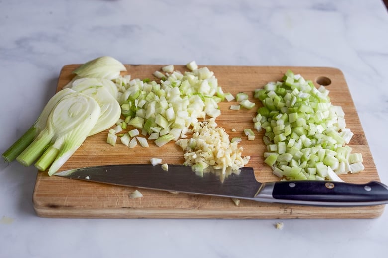 Chopping celery, garlic and fennel.